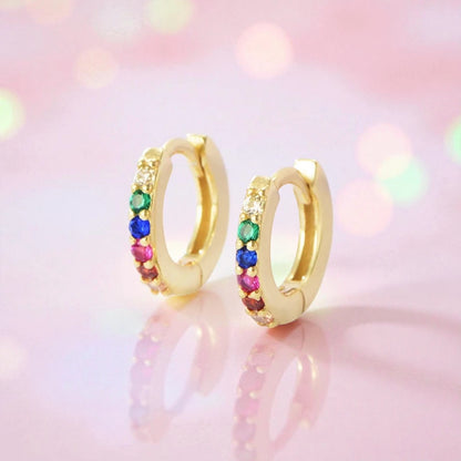 Baby hoop earrings featuring rainbow cubic zirconia set in 925 sterling silver with 18k gold plating.