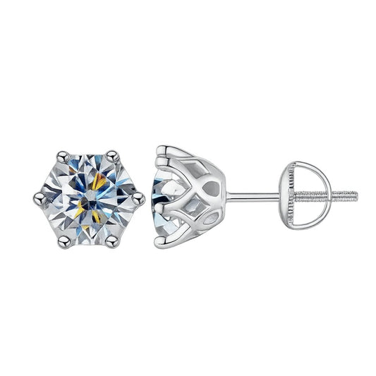 High-resolution product image of round-cut moissanite stud earrings in polished sterling silver six-prong settings with screw-back posts, displayed on a crisp white background