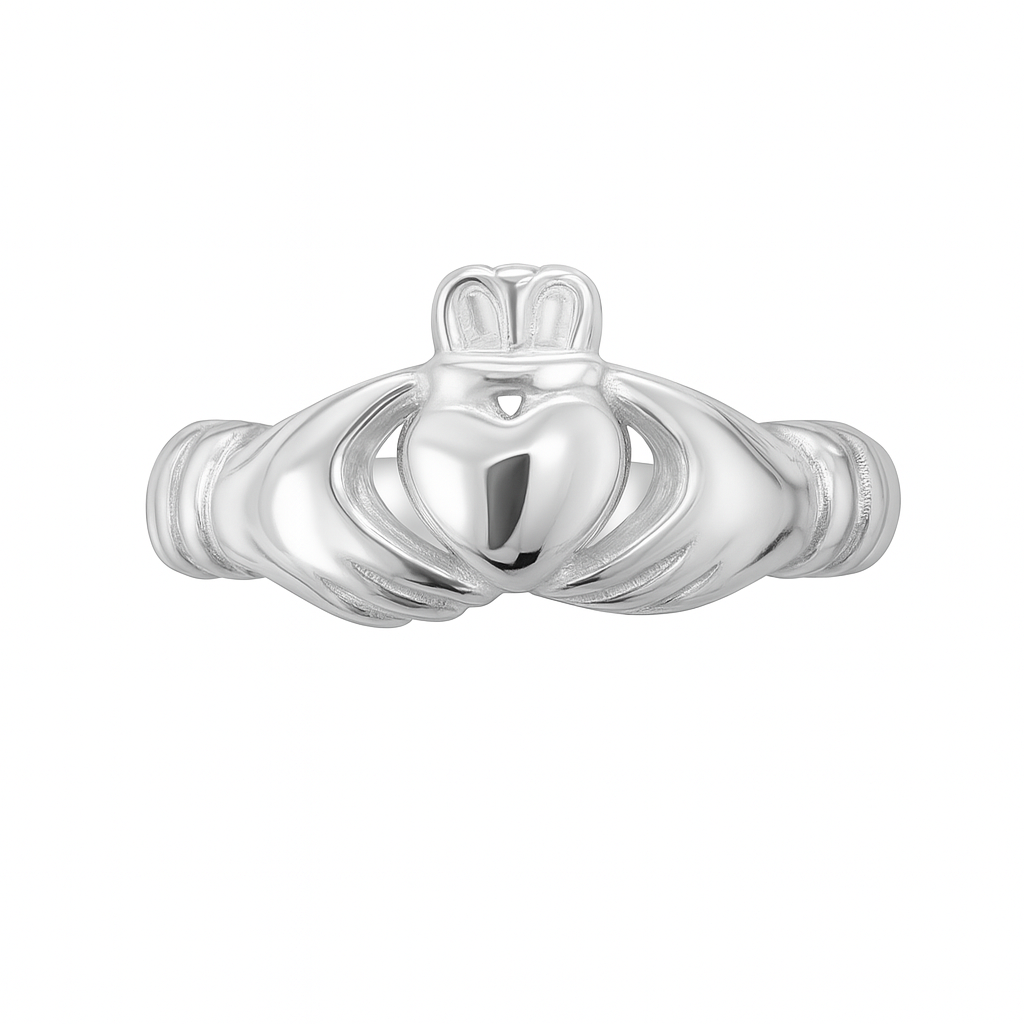 Close-up of a sterling silver Claddagh ring on a white background, featuring a polished heart held by two hands and topped with a detailed crown.