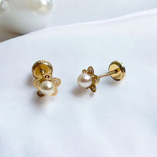 A pair of children's earrings featuring gold flower designs with cultured pearls, viewed from the back showing the screw backs.