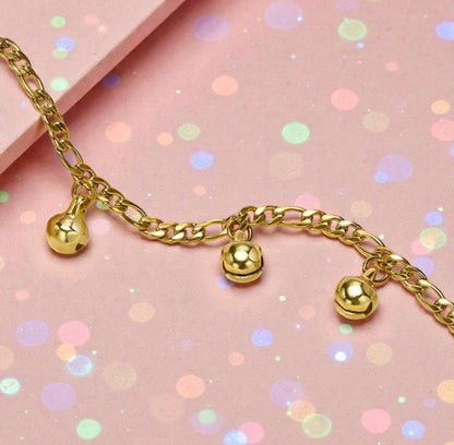 Children's anklets featuring playful gold musical bell charms on a colorful background.