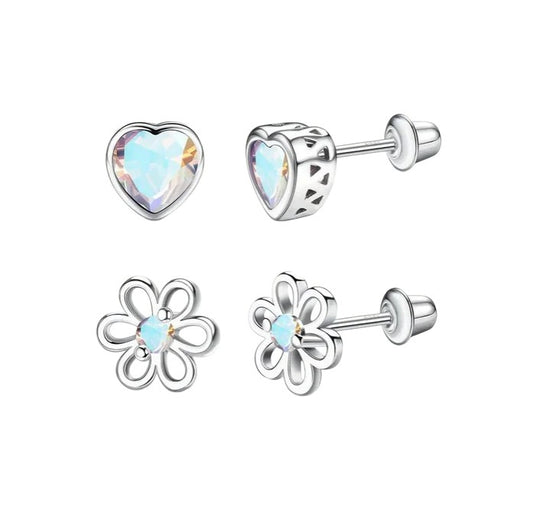 Pair of silver earrings with heart and flower designs on a white background