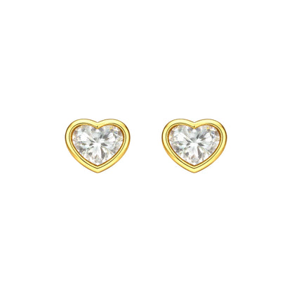 Children's earrings featuring 14k solid gold heart shaped bezel set cubic zirconia studs.