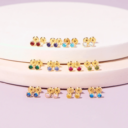 January Birthstone Earrings for babies and children, featuring colorful 3mm garnet CZ stud design in 14k gold.