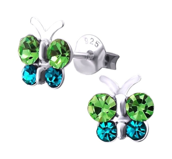 Butterfly-shaped earrings with green and blue gemstones on a white background