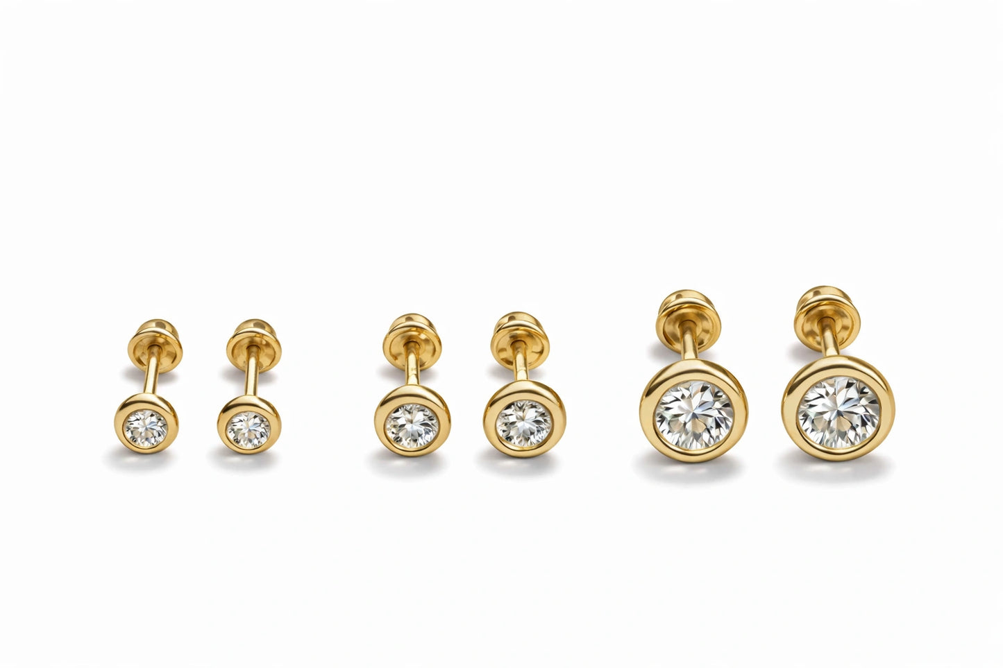 Children's earrings in 14k solid gold with bezel set round CZ studs for kids ages 3 to 10.