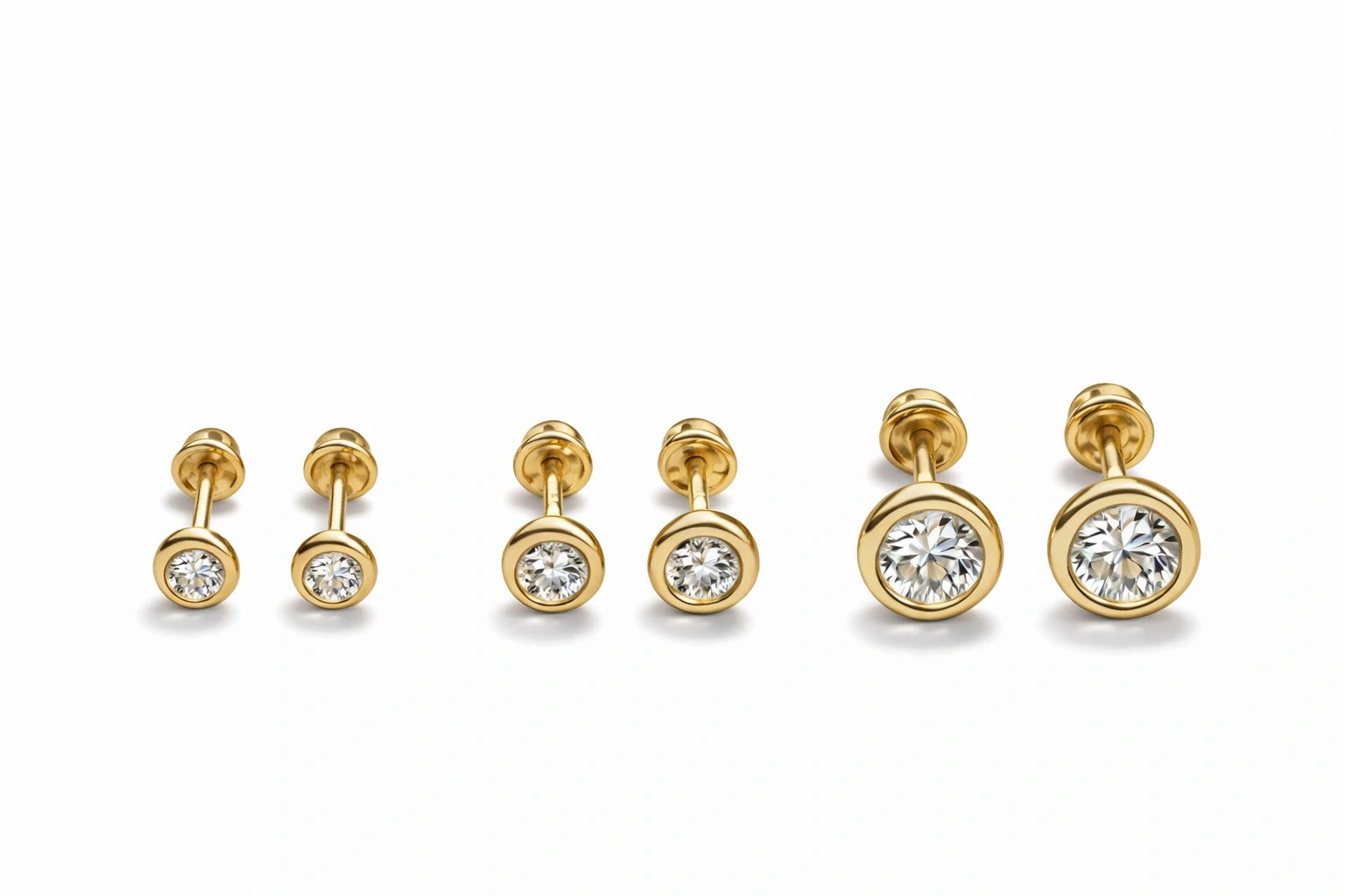 Children's earrings in 14k solid gold with bezel set round CZ studs for kids ages 3 to 10.