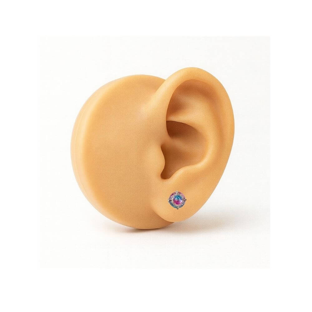 CZ earrings showcased on a model ear, featuring 6mm fireworks gradient cubic zirconia studs in rose and blue.