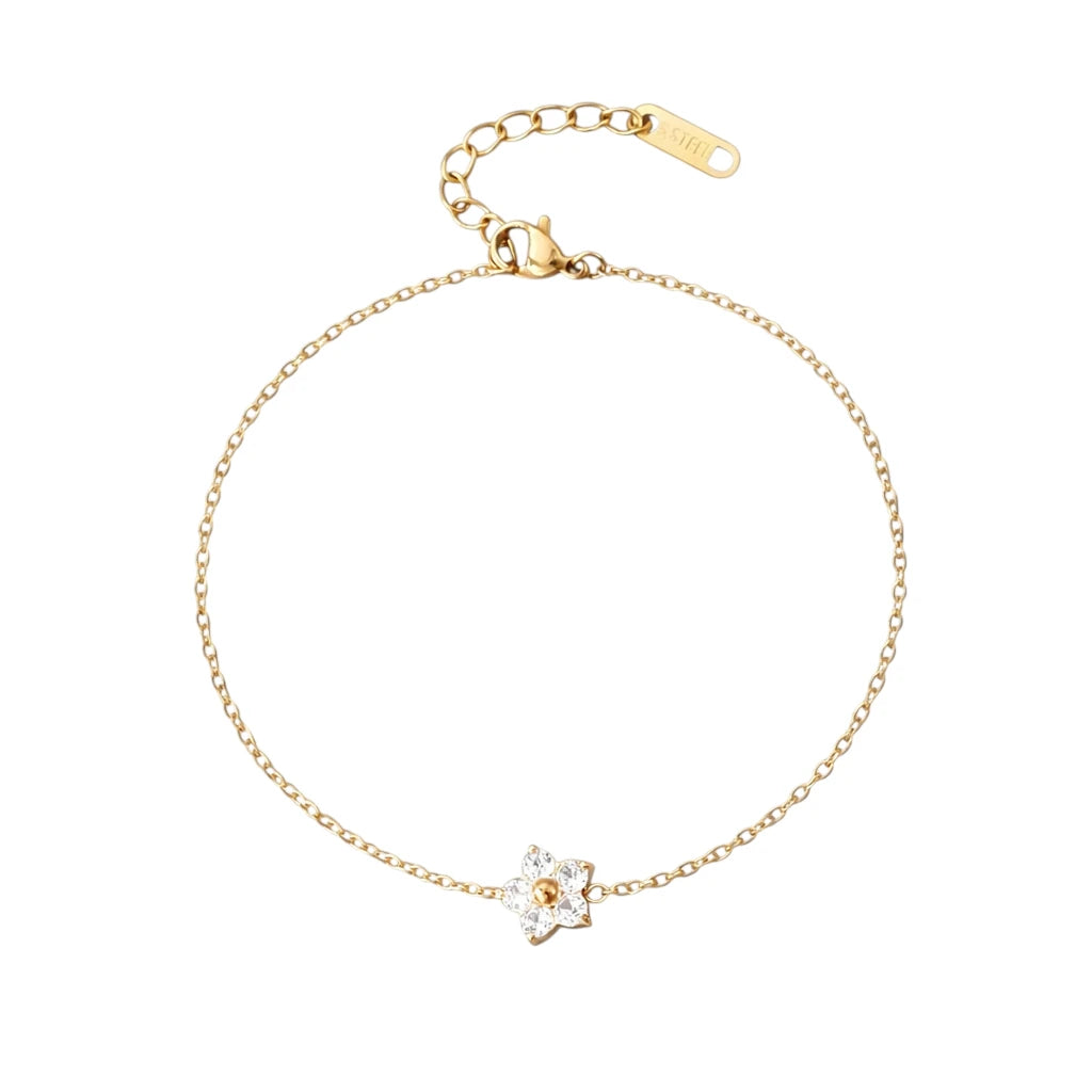 Children's bracelets featuring a delicate clear CZ flower charm on a 18k gold plated adjustable chain.