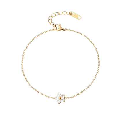 Children's bracelets featuring a delicate clear CZ flower charm on a 18k gold plated adjustable chain.