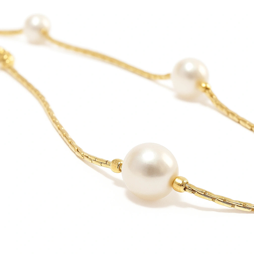 Children's anklet - gold plated chain featuring three lustrous white faux pearls.