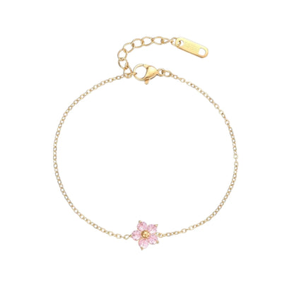 Children's bracelets featuring an 18k gold plated chain and a pink CZ flower charm.