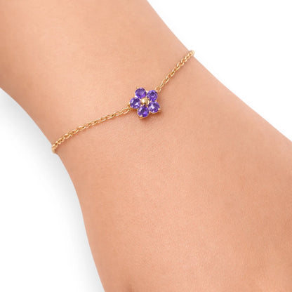 Children's bracelets with a purple CZ flower charm on an adjustable gold-plated chain, ideal for young girls.