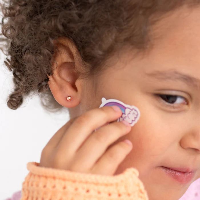 Children's earrings - 14k solid rose gold ball stud screw backs being worn by a girl.