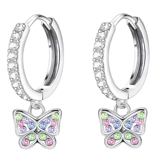 Children's earrings featuring 316L surgical steel huggie hoops and colorful butterfly charms with cubic zirconia.