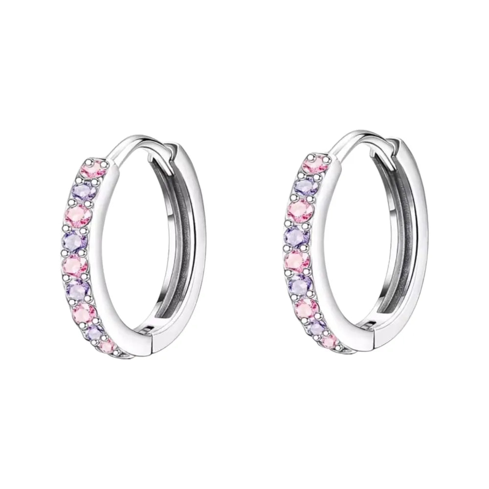 Children's earrings featuring pink and purple CZ stones in 316L surgical steel huggie hoops.