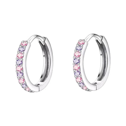 Children's earrings featuring pink and purple CZ stones in 316L surgical steel huggie hoops.