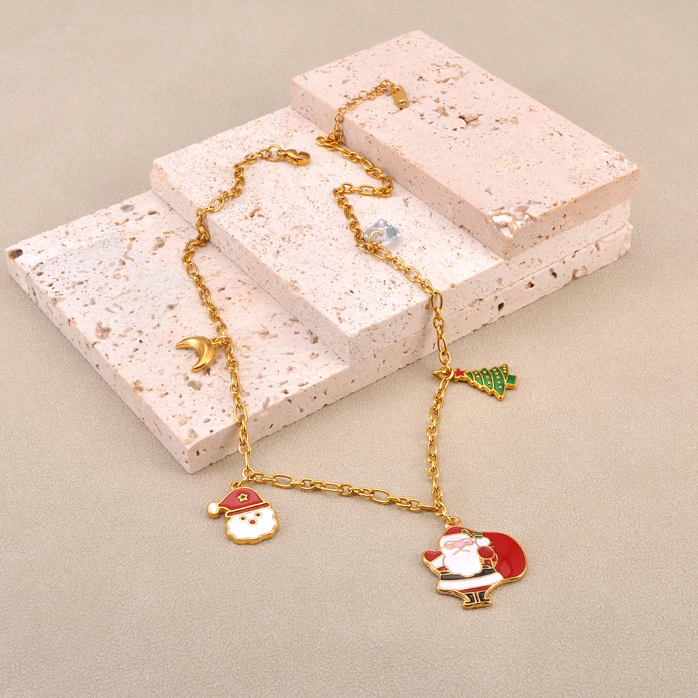 Christmas necklace featuring 316L surgical steel and 18k gold plated Santa Claus charm with colorful enamel details.