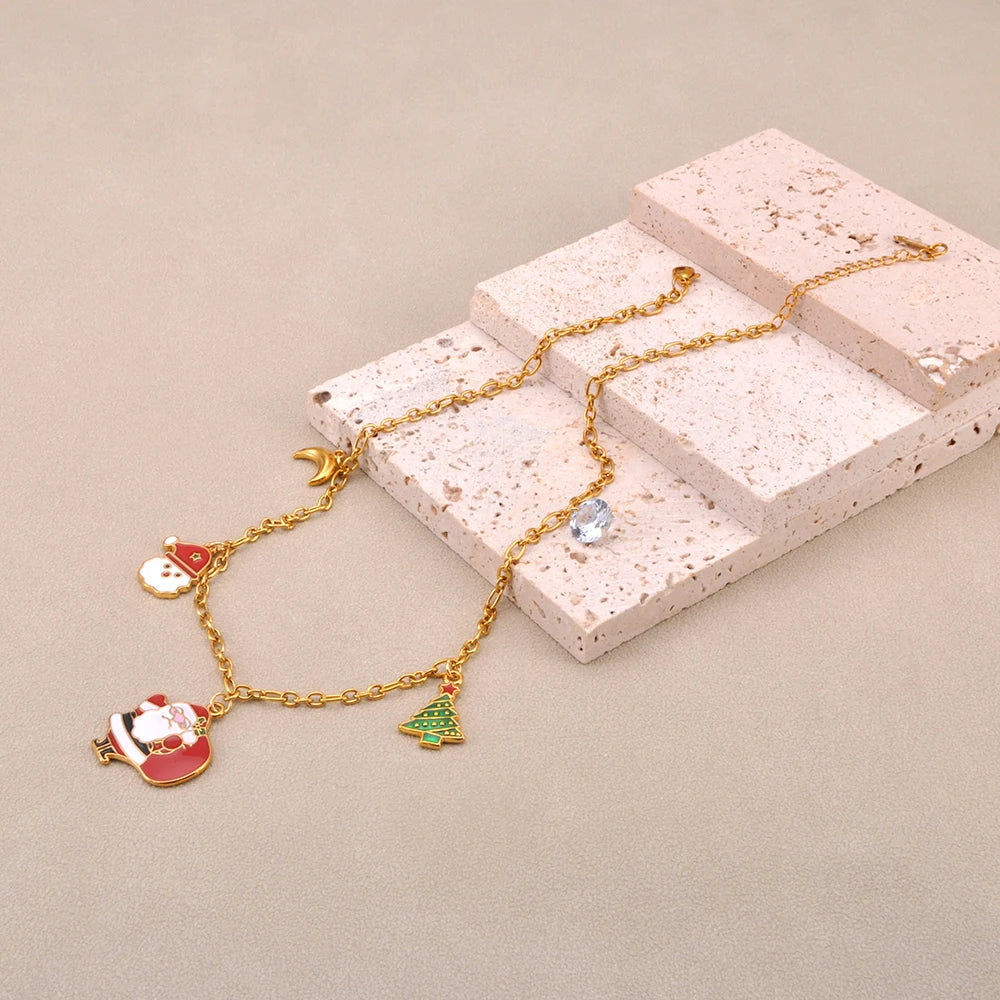 Festive Christmas necklace featuring 316L surgical steel, 18k gold plating, and colorful Santa Claus charm.