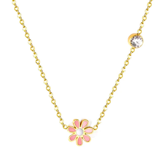 Daisy necklace featuring a pink enamel daisy pendant and clear CZ accent on a gold chain.