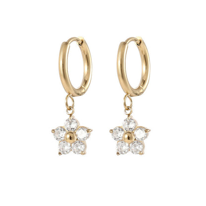 Flower hoop earrings featuring 18k gold plating and purple CZ flower charms for a playful look.