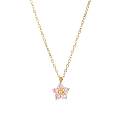 Flower necklace featuring a gold chain and a pink cubic zirconia flower pendant, crafted for elegance and charm.