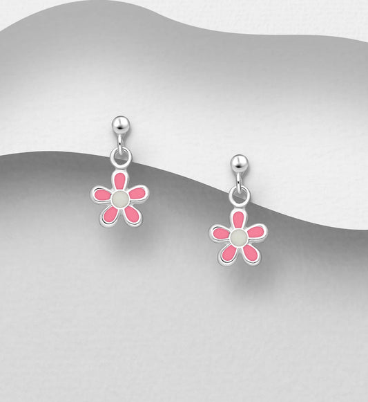 Pink enamel flower dangle earrings with sterling silver ball post – styled against curved grey surface