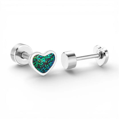 Baby earrings in surgical steel featuring glitter enamel heart studs with screw backs.