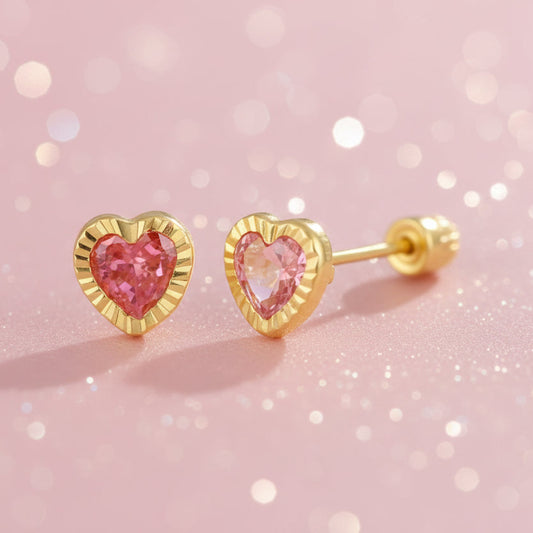 Heart earrings featuring 14k solid gold and pink cubic zirconia heart studs with a charming design.