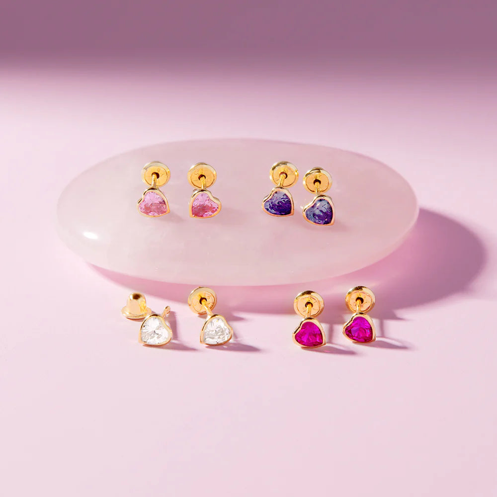 Heart earrings featuring purple and pink cubic zirconia in 14k yellow gold bezel settings with screw backs.