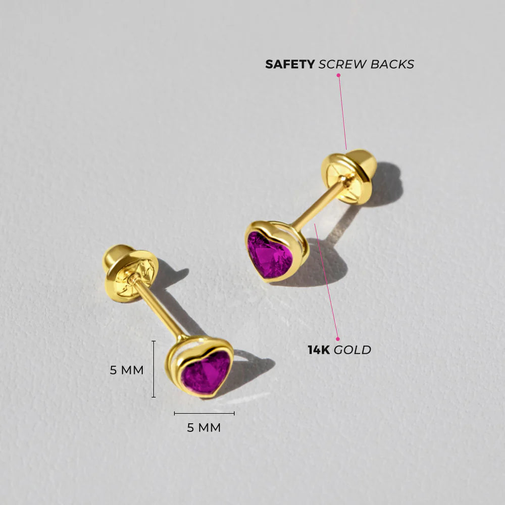 Heart earrings in solid 14k gold with 4mm bezel-set ruby cubic zirconia and safety screw backs.