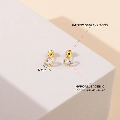 Heart earrings in 14k yellow gold with clear CZ, 5mm size, featuring safety screw backs for secure wear.