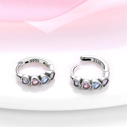 Heart hoop earrings in 925 sterling silver with pink, purple, and blue cubic zirconia stones.