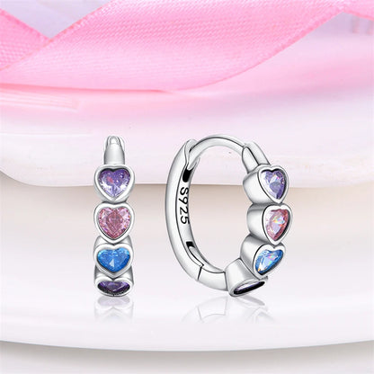 Heart hoop earrings made of 925 sterling silver featuring pink, purple, and blue cubic zirconia hearts for vibrant charm.