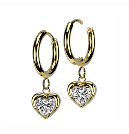 Heart hoop earrings made of gold surgical steel with sparkling CZ heart charms.