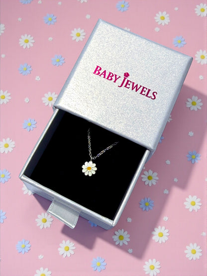 Children's necklace displayed in a silver box with a daisy pendant, perfect gift for young girls.
