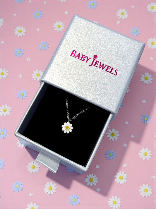 Children's necklace displayed in a silver box with a daisy pendant, perfect gift for young girls.