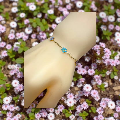 Sweet Spring Blooms Bracelet for Girls displayed on a hand surrounded by colorful flowers, showcasing its charm and design.