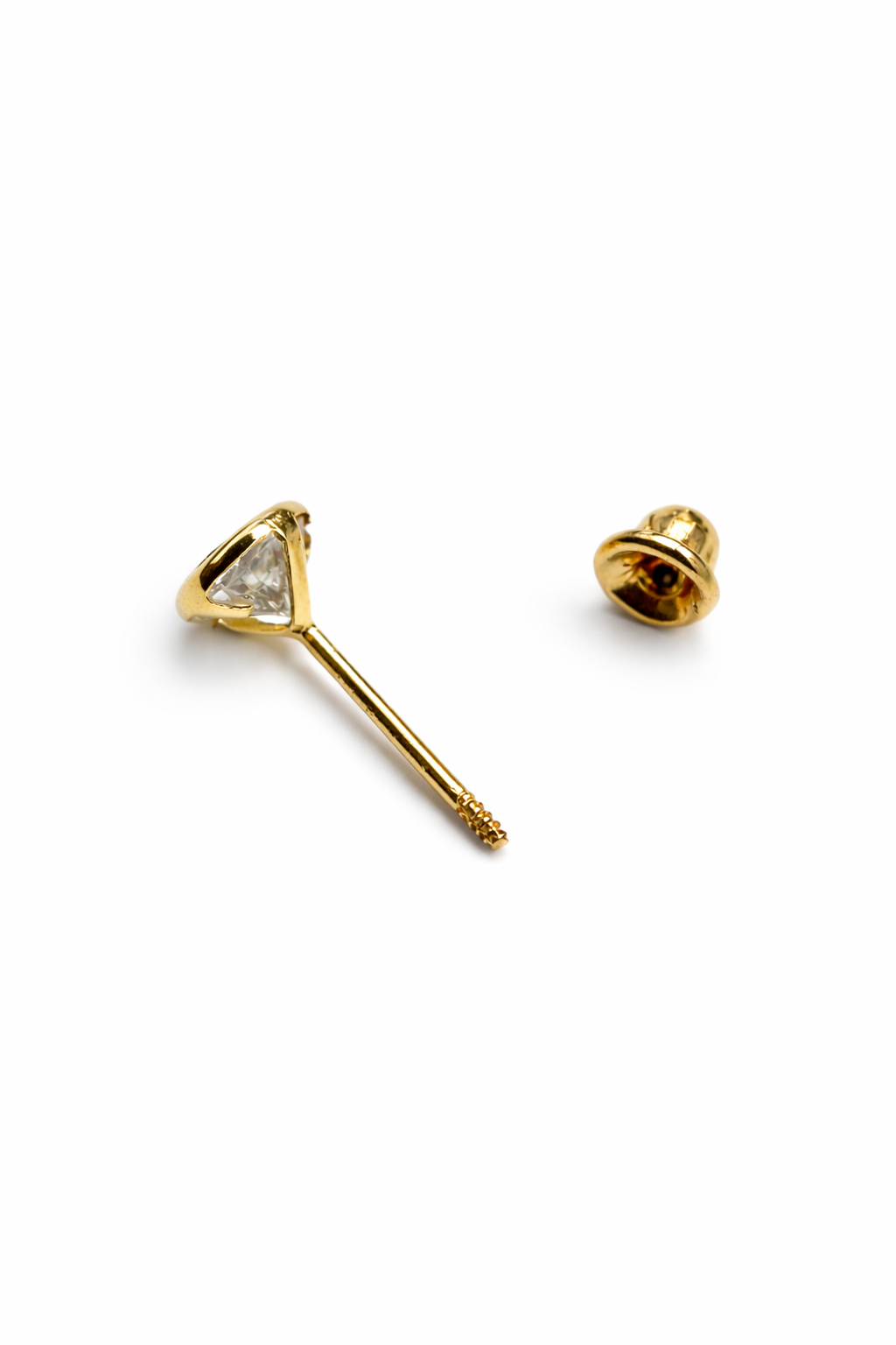 Children's earrings featuring a 14k solid gold bezel set round CZ screw back stud for kids.