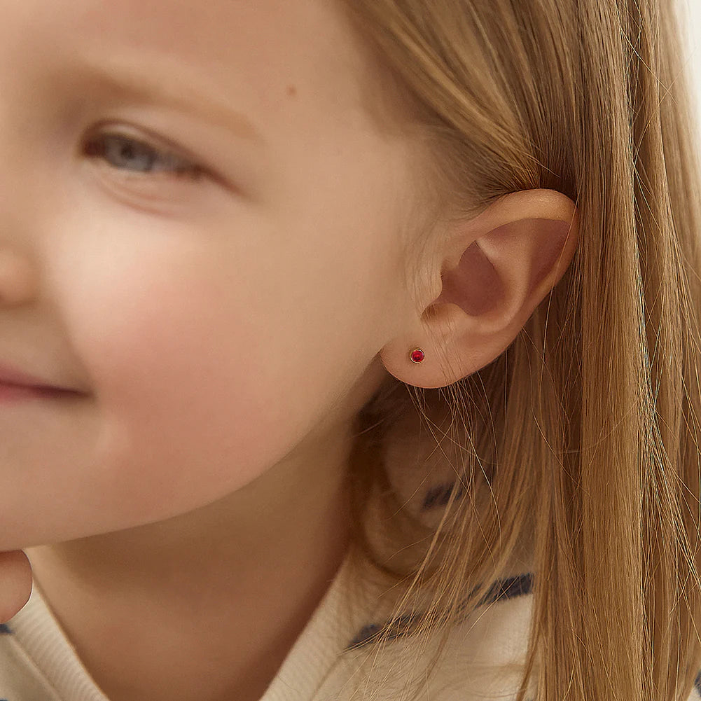 January Birthstone Earrings for babies & children featuring 3mm garnet CZ stud earrings in 14k gold.