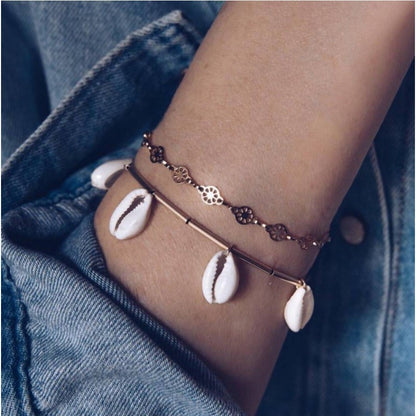 Layered bracelet set featuring three pieces with coastal accents for a stylish, beachy look.