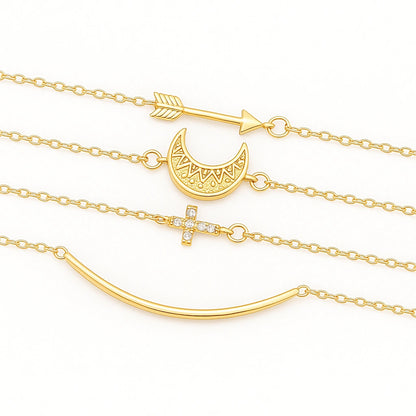 Layered bracelet set featuring crescent moon, cross, and arrow charms for a trendy layered look.