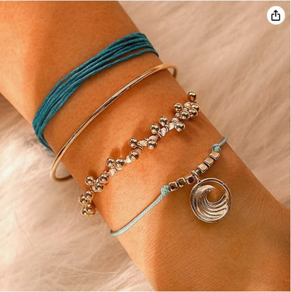Layered bracelet set featuring three pieces with ocean-inspired accents, showcasing trendy style and elegance.