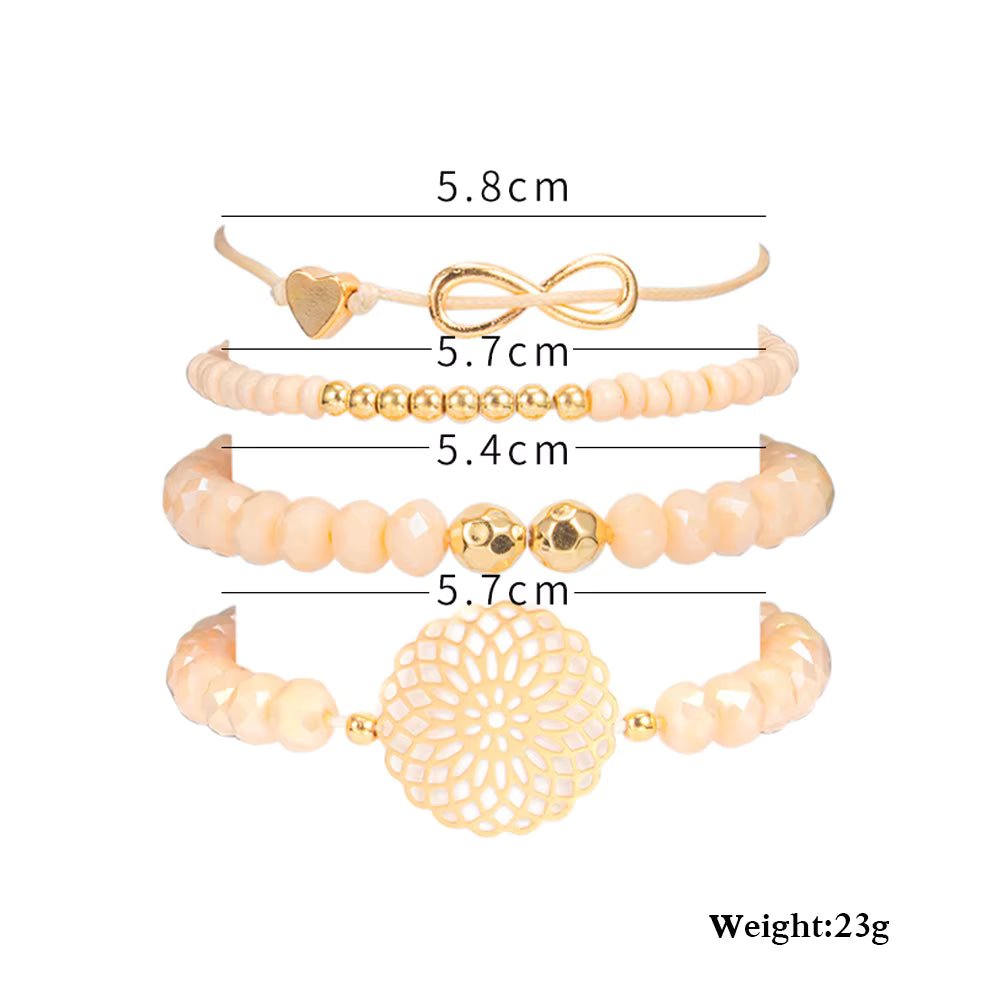 Set of gold and beige bracelets with measurements on a white background