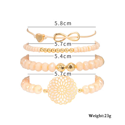 Set of gold and beige bracelets with measurements on a white background