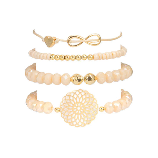 layered bracelet set featuring four stylish bracelets with neutral accents and gold details for versatile layering.