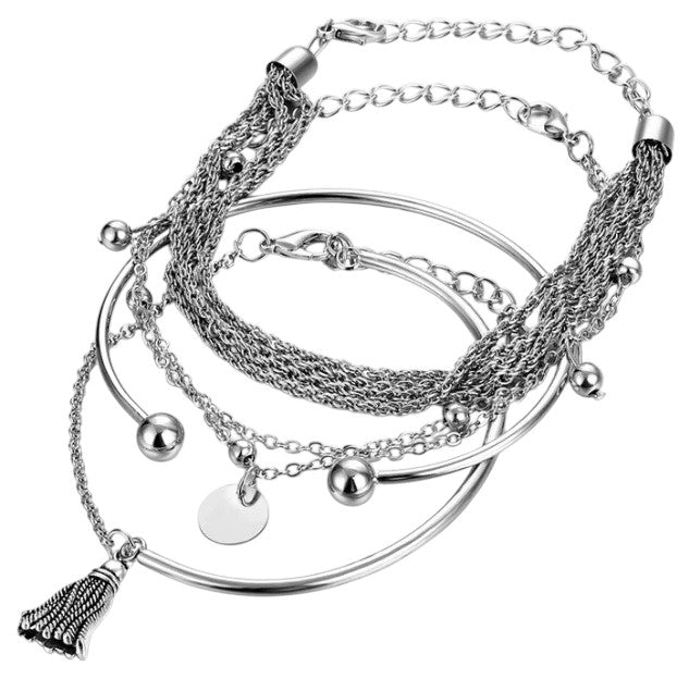 Layered bracelet - 3-piece silver-tone tassel layered bracelet set showcasing stylish chains and silver accents.