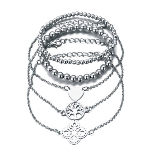 Layered bracelet set featuring three stylish bracelets with tree of life accents, ideal for chic layered looks.