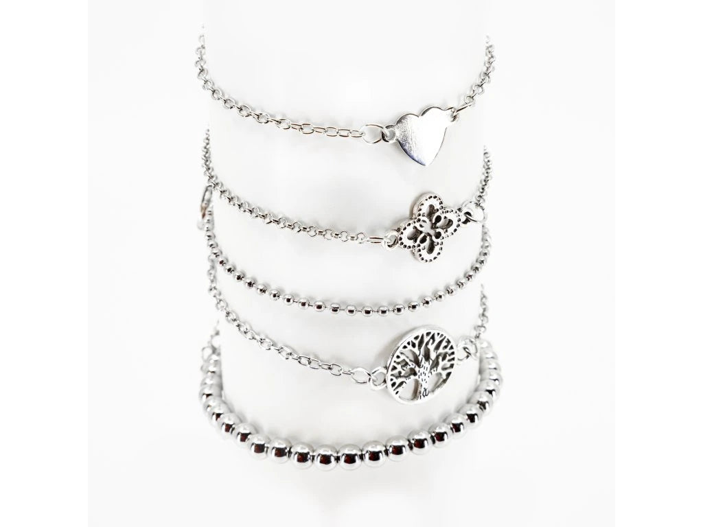 Layered bracelet set featuring three bracelets with tree of life accents, perfect for chic layered looks.