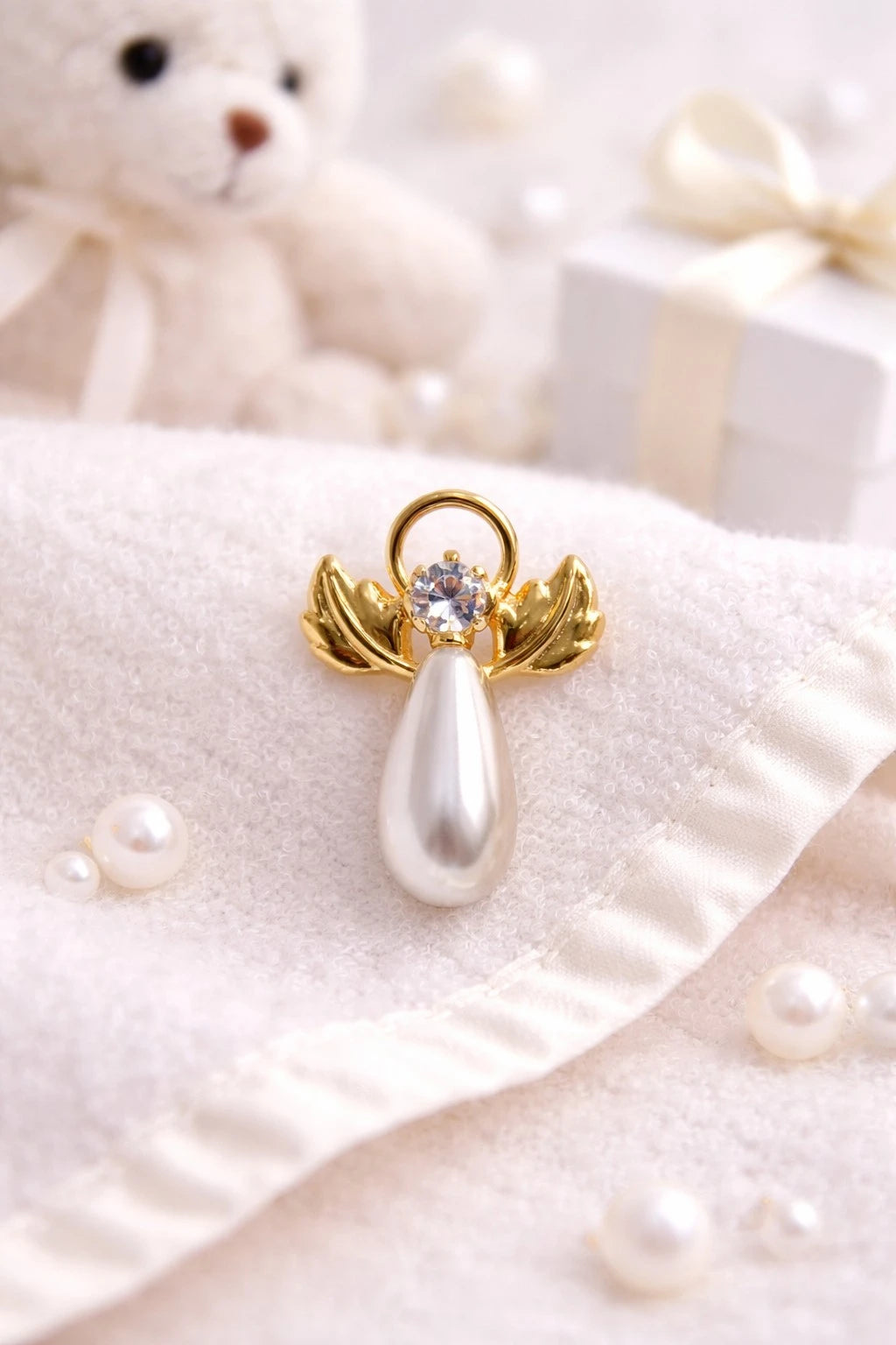 New baby gift featuring a stunning angel pin in gold plating with faux pearl and Austrian crystal, perfect for newborn celebrations.